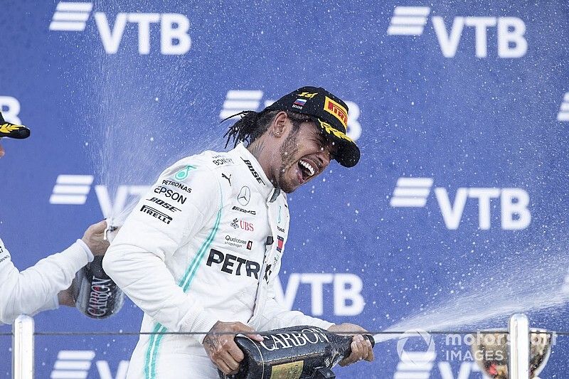 Second place Valtteri Bottas, Mercedes AMG W10 and race winner Lewis Hamilton, Mercedes AMG F1 W10 spray champagne on the podium