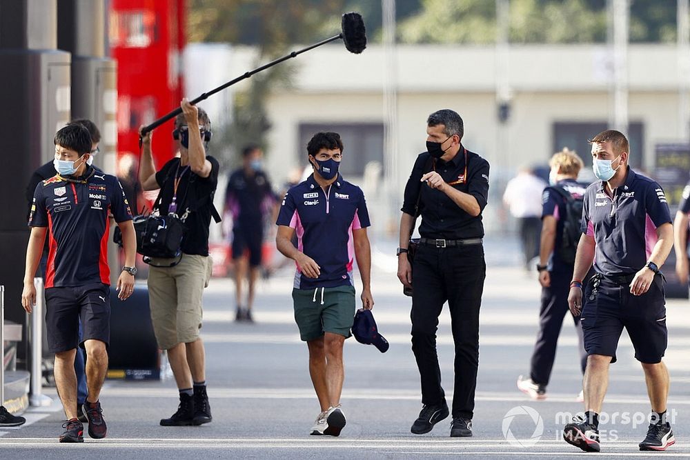 Sergio Perez, Racing Point speaks with Guenther Steiner, Team Principal, Haas F1 