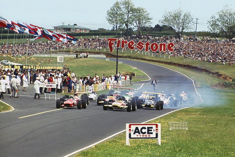 Chris Amon, Ferrari 246T leads Jochen Rindt, Lotus 49B-Ford