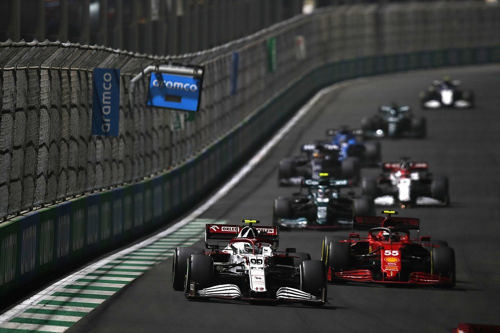 Antonio Giovinazzi, Alfa Romeo Racing C41, Carlos Sainz Jr., Ferrari SF21, and Sebastian Vettel, Aston Martin AMR21