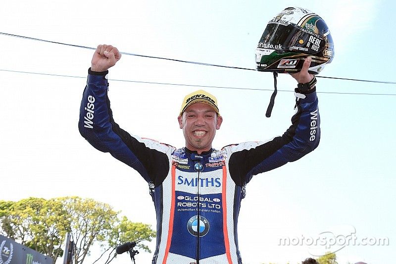 Peter Hickman celebrates after winning the RL360º Superstock TT race