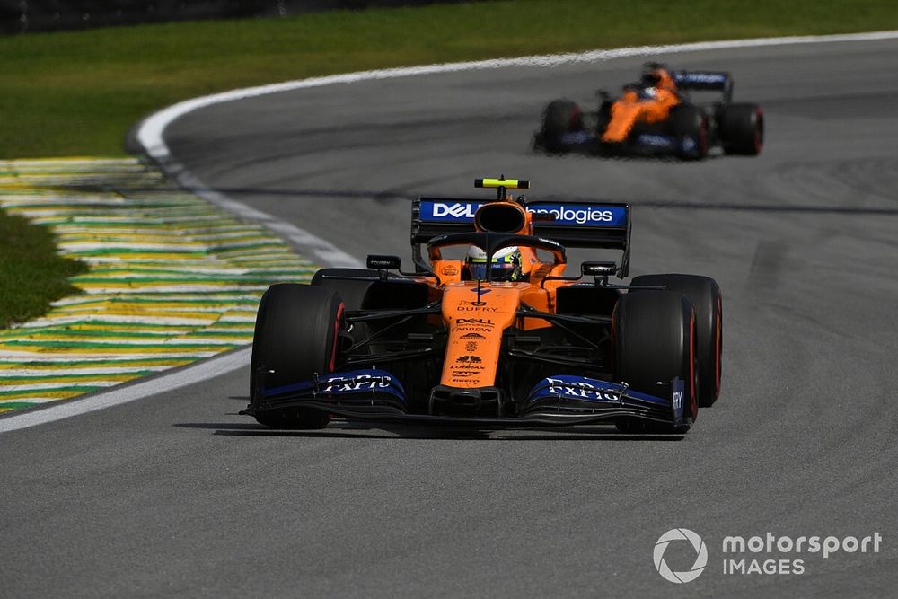 Lando Norris, McLaren MCL34, leads Carlos Sainz Jr., McLaren MCL34