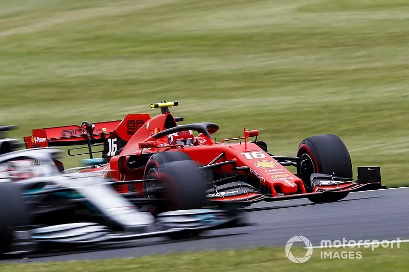 Charles Leclerc, Ferrari SF90, passes Lewis Hamilton, Mercedes AMG F1 W10