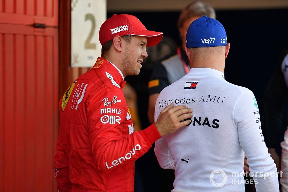 Sebastian Vettel, Ferrari, talks with Pole man Valtteri Bottas, Mercedes AMG F1, after Qualifying