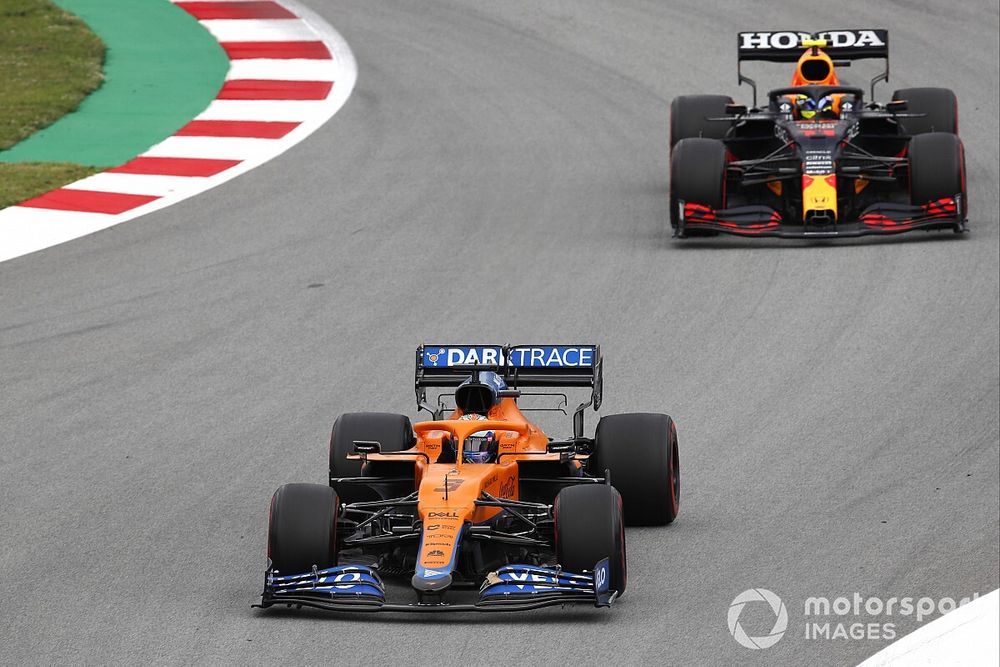 Daniel Ricciardo, McLaren MCL35M, leads Sergio Perez, Red Bull Racing RB16B