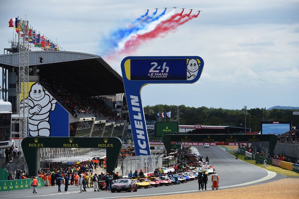 The Patrouille de France flies over the grid