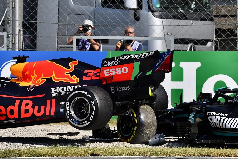 Max Verstappen, Red Bull Racing RB16B, and Lewis Hamilton, Mercedes W12, crash out