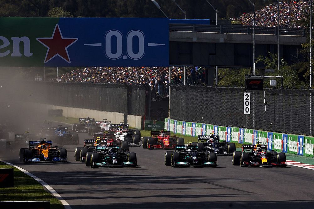 Max Verstappen, Red Bull Racing RB16B, leads Lewis Hamilton, Mercedes W12, Valtteri Bottas, Mercedes W12, Daniel Ricciardo, McLaren MCL35M, Sergio Perez, Red Bull Racing RB16B, and the rest of the field at the start