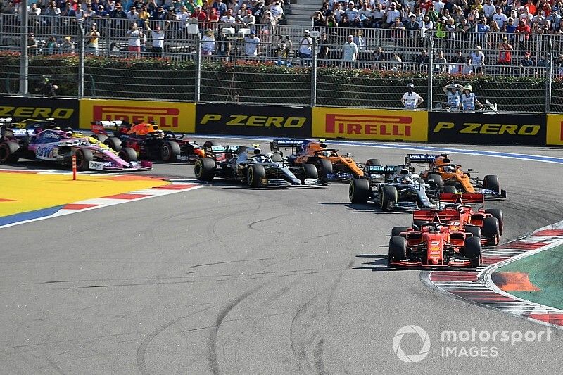 Sebastian Vettel, Ferrari SF90, leads Charles Leclerc, Ferrari SF90, Lewis Hamilton, Mercedes AMG F1 W10, Carlos Sainz Jr., McLaren MCL34, Valtteri Bottas, Mercedes AMG W10, and the rest of the field at the start