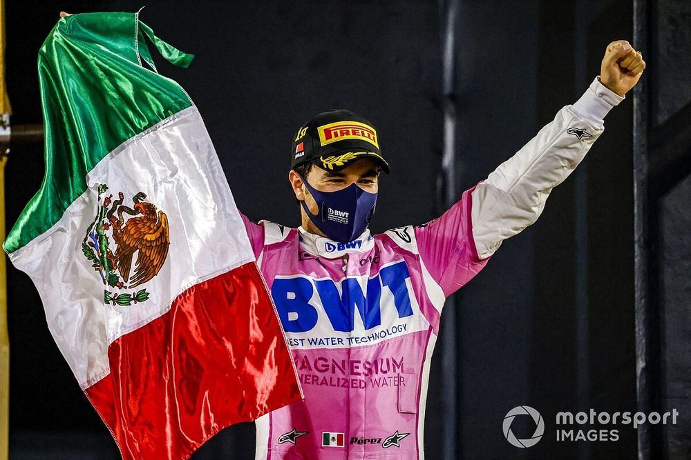 Sergio Perez, Racing Point, 1st position, on the podium with a Mexican flag