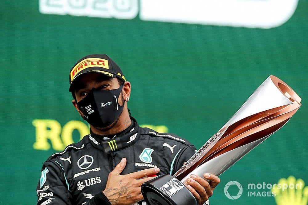 Lewis Hamilton, Mercedes-AMG F1, on the podium after winning the race, to take his 7th World Championship title