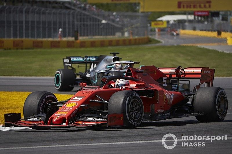 Sebastian Vettel, Ferrari SF90, leads Lewis Hamilton, Mercedes AMG F1 W10