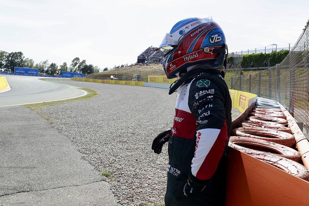 Valtteri Bottas, Alfa Romeo F1 Team, waits by a barrier