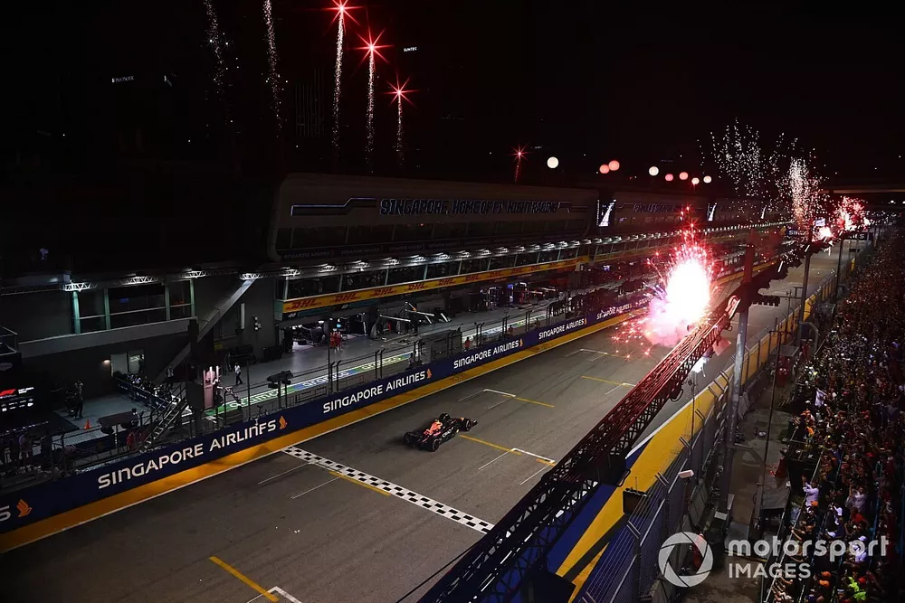 Fireworks light the sky as Sergio Perez, Red Bull Racing RB18, 1st position, takes victory