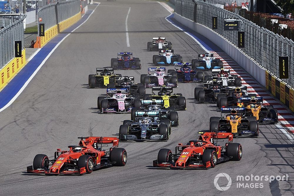 Sebastian Vettel, Ferrari SF90, leads Charles Leclerc, Ferrari SF90, Lewis Hamilton, Mercedes AMG F1 W10, Carlos Sainz Jr., McLaren MCL34, Valtteri Bottas, Mercedes AMG W10, Lando Norris, McLaren MCL34, and the rest of the field at the start