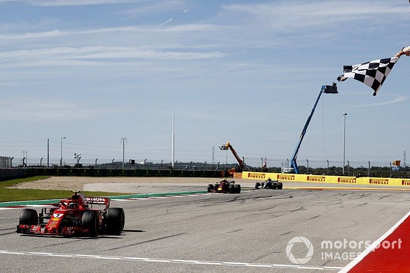 Kimi Raikkonen, Ferrari SF71H, 1st position, takes the chequered flag ahead of Max Verstappen, Red Bull Racing RB14, 2nd position, and Lewis Hamilton, Mercedes AMG F1 W09 EQ Power+, 3rd position