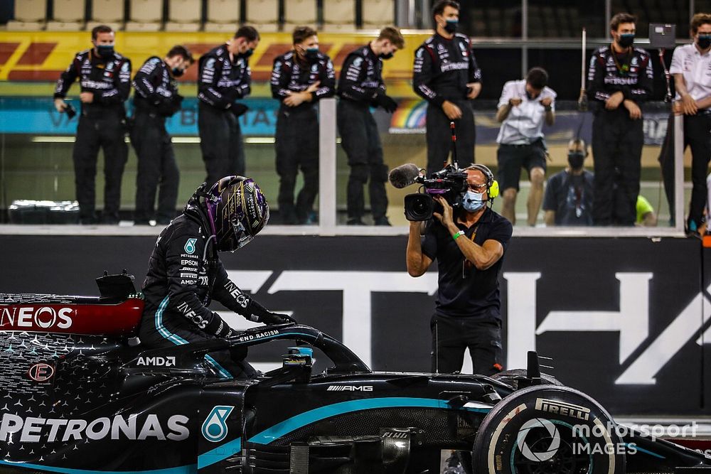 Lewis Hamilton, Mercedes-AMG F1, 3rd position, climbs out of his car after performing donuts at the end of the race