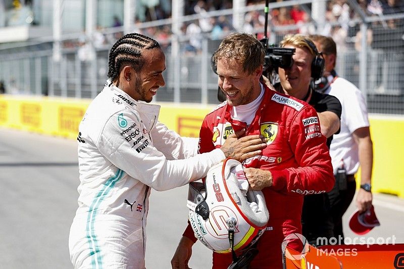 Sebastian Vettel, Ferrari Pole sitter and Lewis Hamilton, Mercedes AMG F1 celebrate in Parc Ferme 