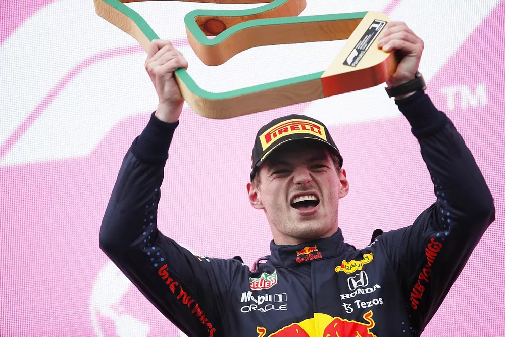 Max Verstappen, Red Bull Racing, 1st position, with his trophy on the podium