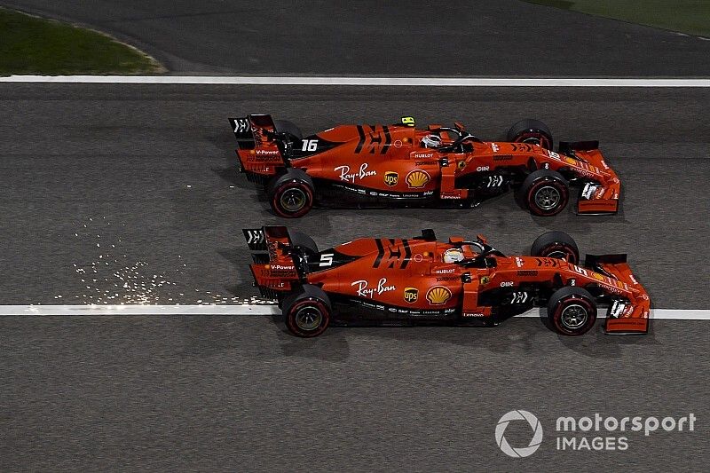 Charles Leclerc, Ferrari SF90 overtakes Sebastian Vettel, Ferrari SF90 for the lead