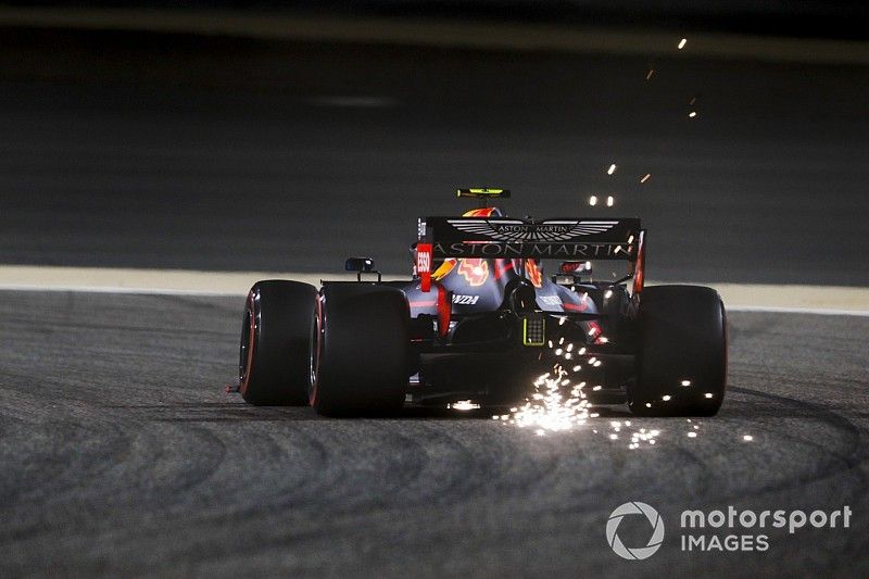 Sparks fly from the rear of Pierre Gasly, Red Bull Racing RB15