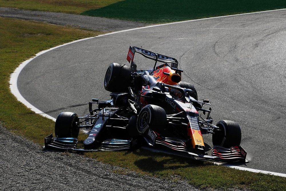 Lewis Hamilton, Mercedes W12, and Max Verstappen, Red Bull Racing RB16B, crash out of the race