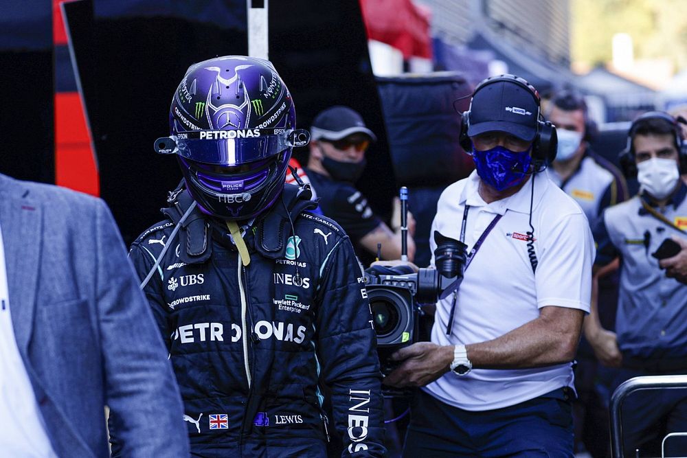 Lewis Hamilton, Mercedes, heads back to his helmet after his crash