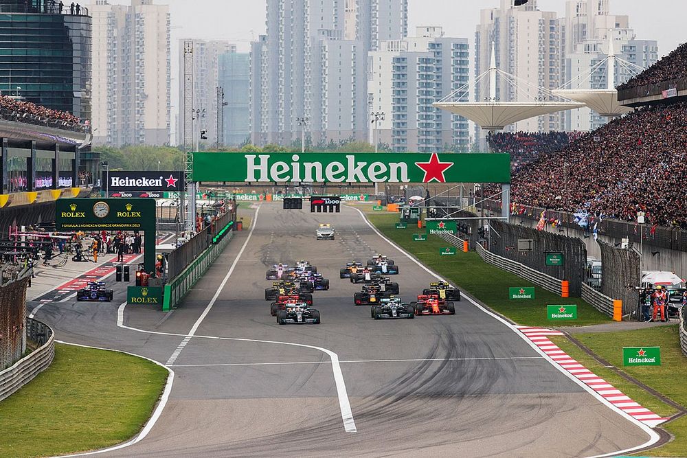 Lewis Hamilton, Mercedes AMG F1 W10, leads Valtteri Bottas, Mercedes AMG W10, Charles Leclerc, Ferrari SF90, Sebastian Vettel, Ferrari SF90, Max Verstappen, Red Bull Racing RB15, and the rest of the field towards the first corner