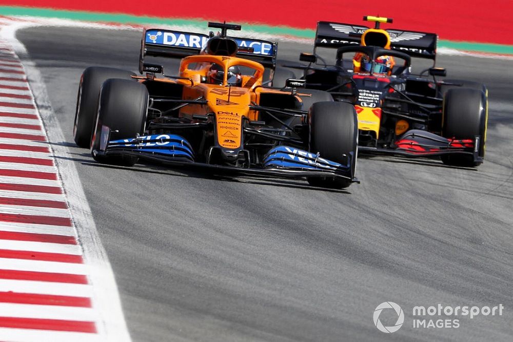 Carlos Sainz Jr., McLaren MCL35, leads Alex Albon, Red Bull Racing RB16