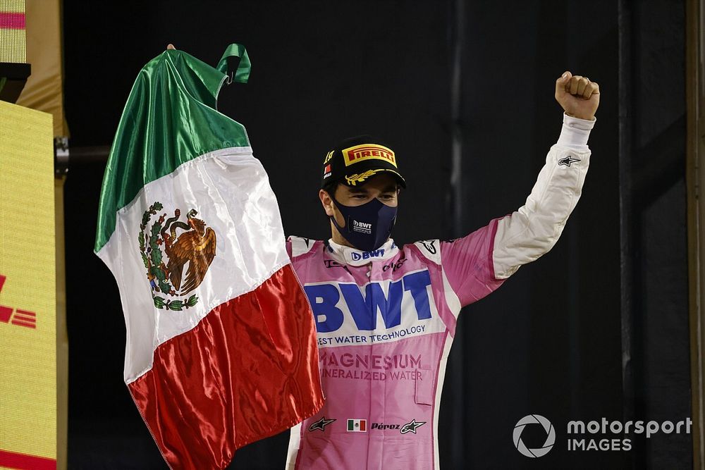 Sergio Perez, Racing Point, 1st position, on the podium with the Mexican flag