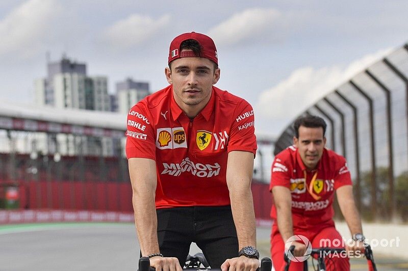 Charles Leclerc, Ferrari walks the track on a bike