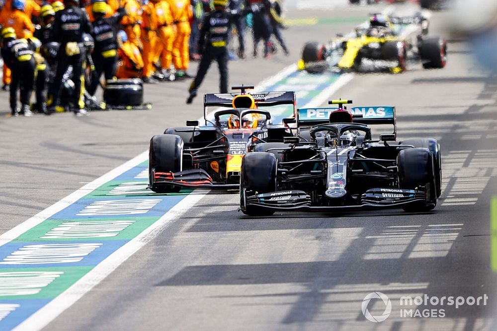 Valtteri Bottas, Mercedes F1 W11, Max Verstappen, Red Bull Racing RB16, in the pits