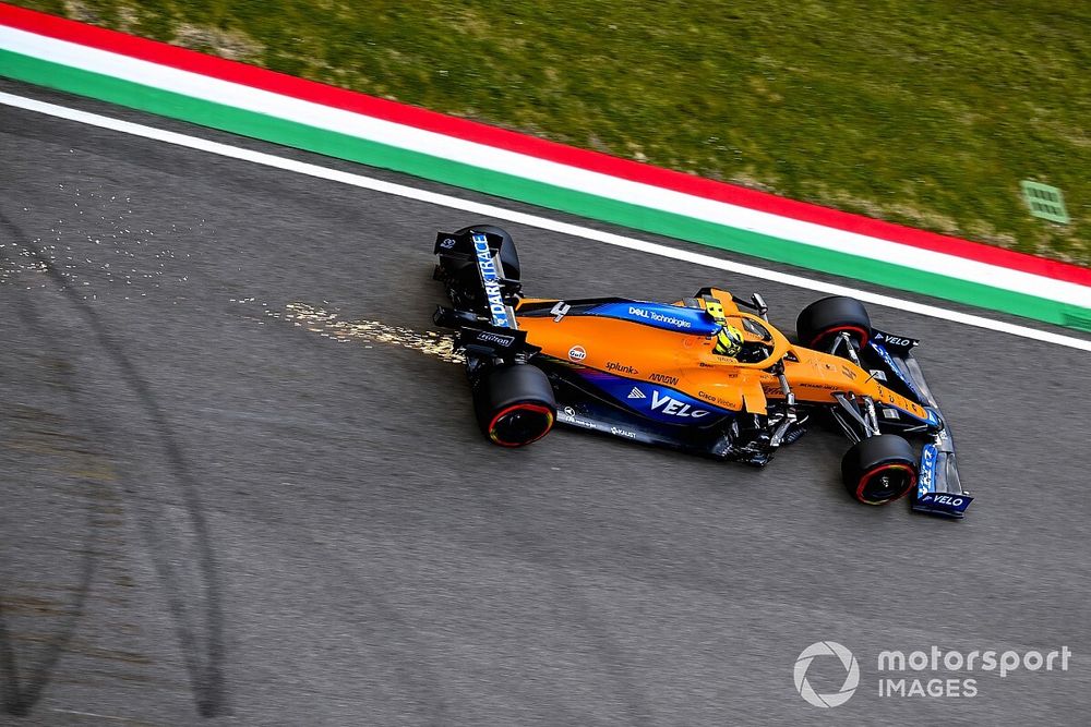 Sparks trail behind Lando Norris, McLaren MCL35M