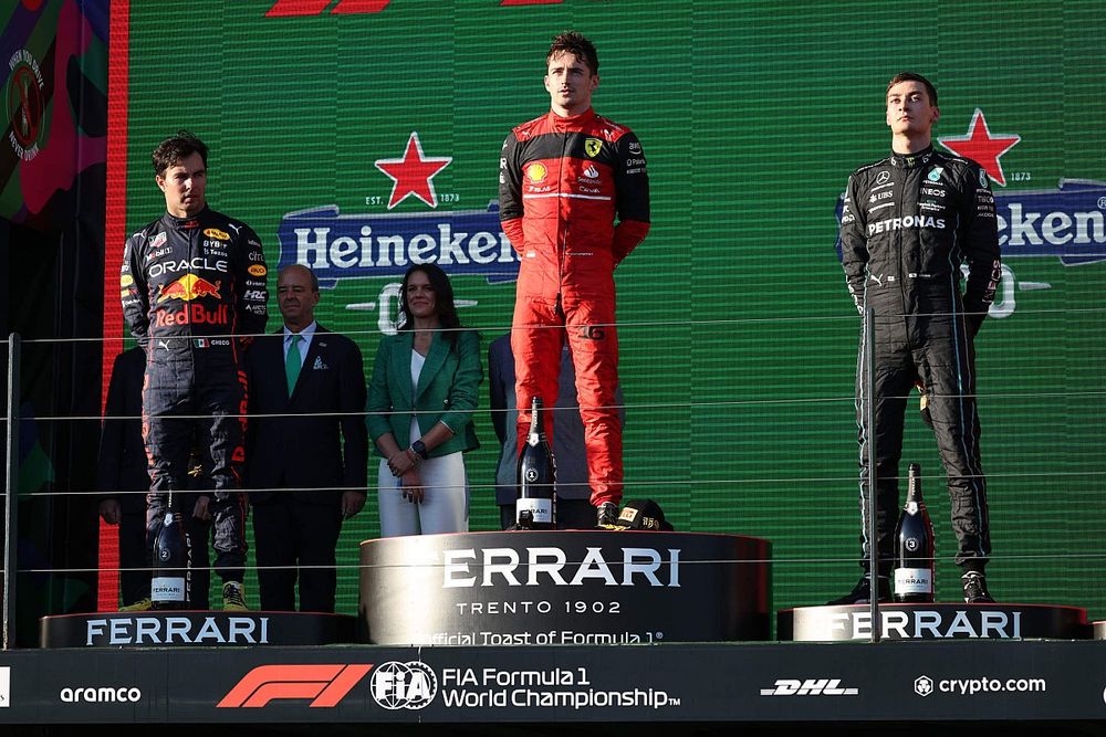 Sergio Perez, Red Bull Racing, 2nd position, Charles Leclerc, Ferrari, 1st position, George Russell, Mercedes-AMG, 3rd position, on the podium