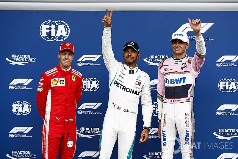 Sebastian Vettel, Ferrari, with Esteban Ocon, Racing Point Force India VJM1, and pole sitter Lewis Hamilton, Mercedes AMG F1