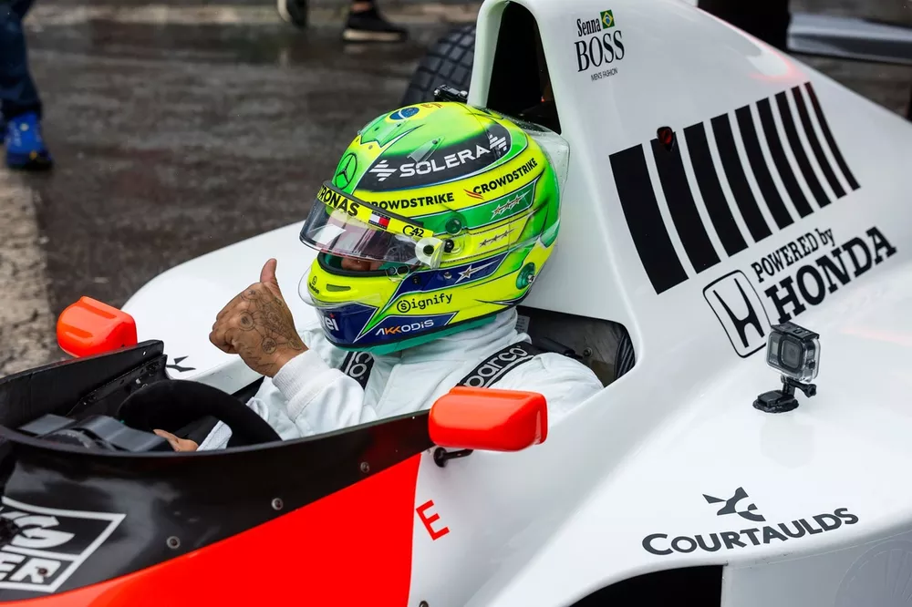 Lewis Hamilton prepares to drive Ayrton Senna's McLaren MP4/5B