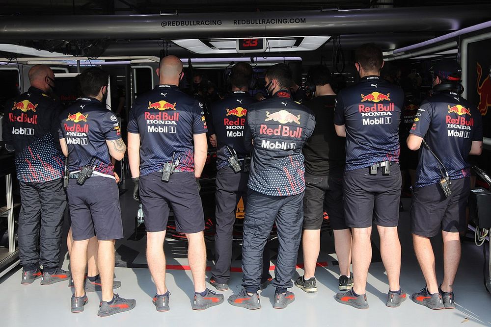 Red Bull Racing members cover the RB16B