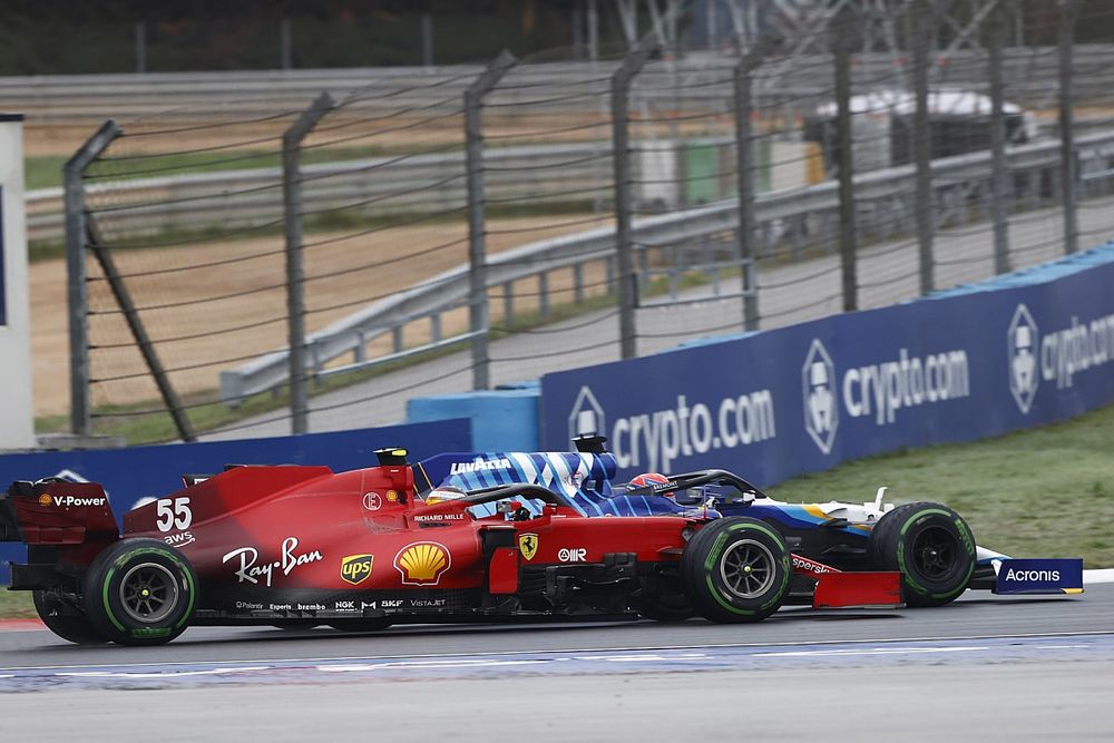 George Russell, Williams FW43B, passes Carlos Sainz Jr., Ferrari SF21