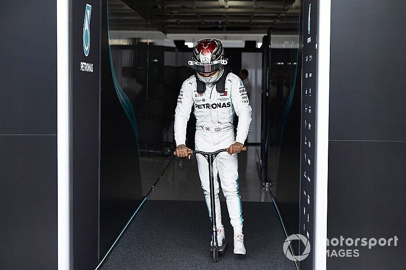 Lewis Hamilton, Mercedes AMG F1, on a scooter