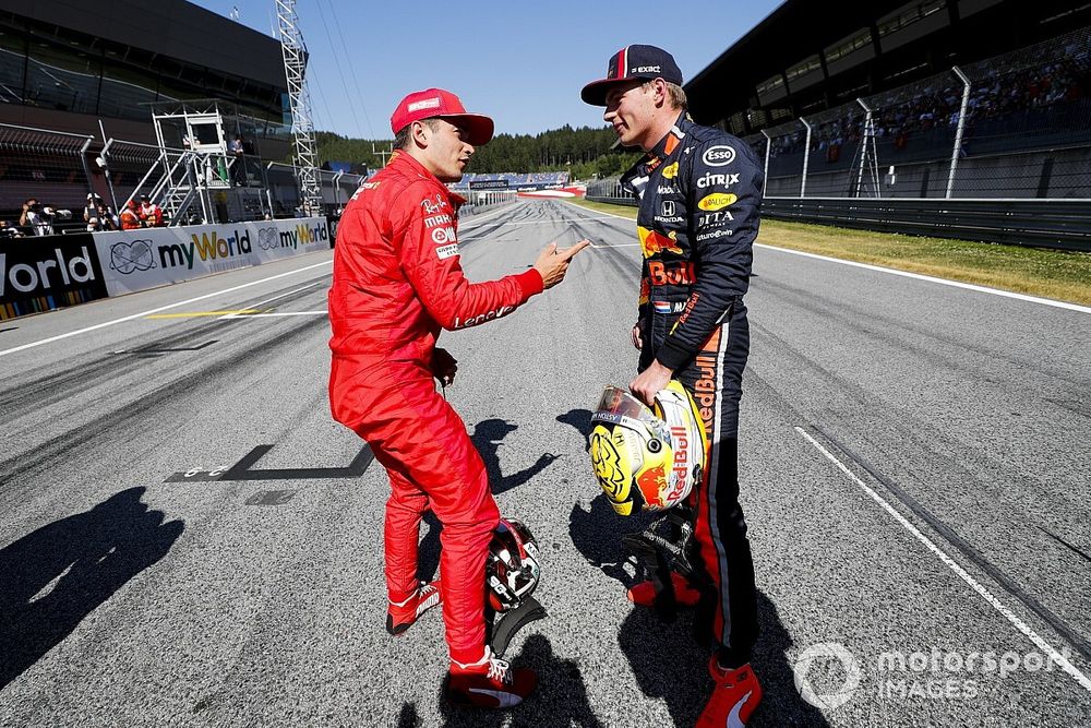 Pole sitter Charles Leclerc, Ferrari, talks with Max Verstappen, Red Bull Racing