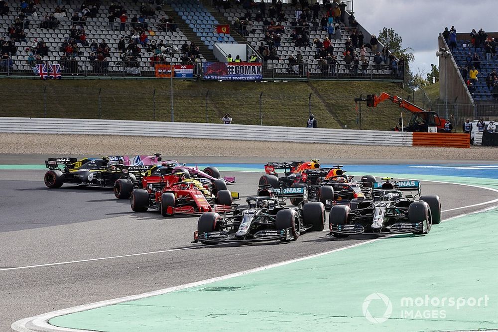 Valtteri Bottas, Mercedes F1 W11, and Lewis Hamilton, Mercedes F1 W11, lead the field away at the start