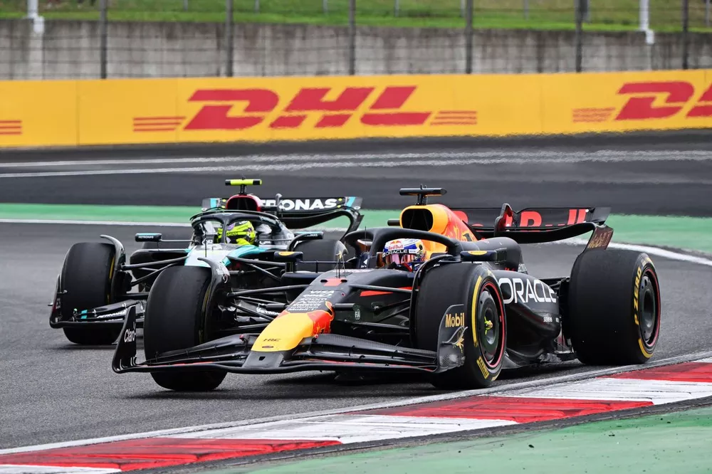 Max Verstappen, Red Bull Racing RB20 battles with Sir Lewis Hamilton, Mercedes F1 W15