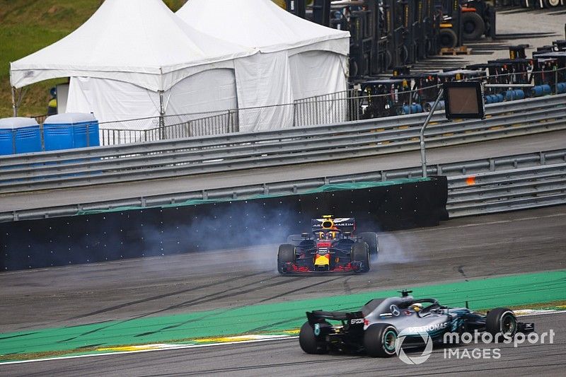 Lewis Hamilton, Mercedes AMG F1 W09, passes a spinning Max Verstappen, Red Bull Racing RB14 Tag Heuer, after the latter suffers a collision with Esteban Ocon, Force India VJM11 Mercedes. 