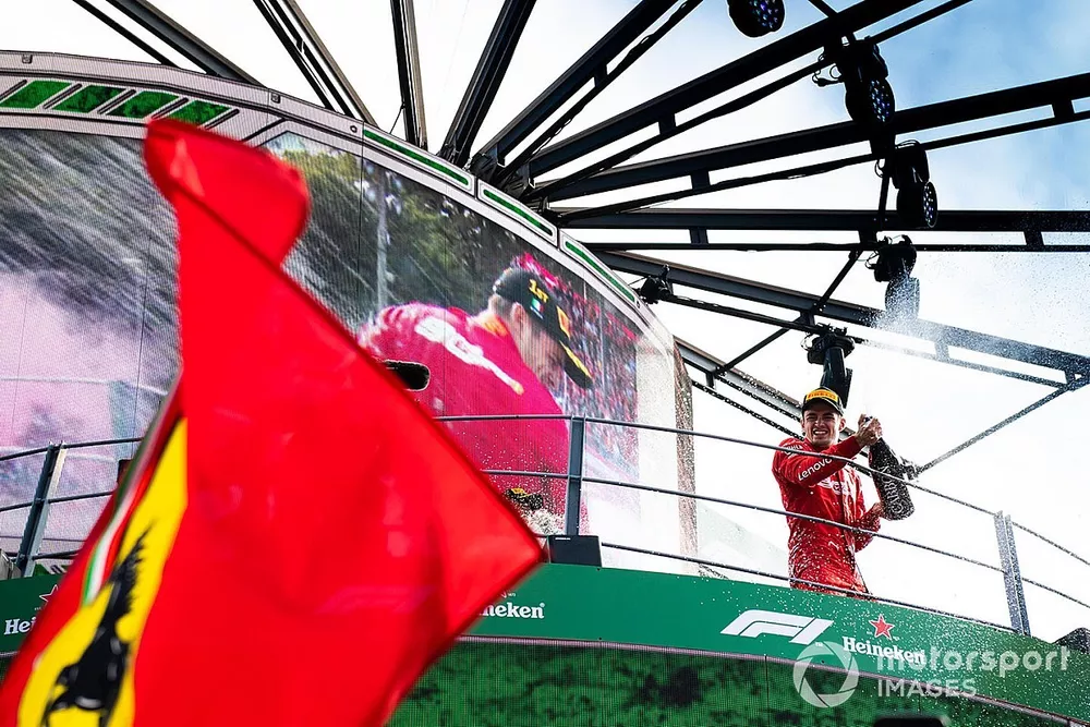 Charles Leclerc, Ferrari, 1st position, celebrates with Champagne on the podium
