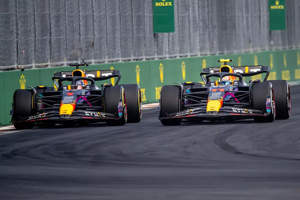 Sergio Perez, Red Bull Racing RB19, battles with Max Verstappen, Red Bull Racing RB19, for the lead of the race