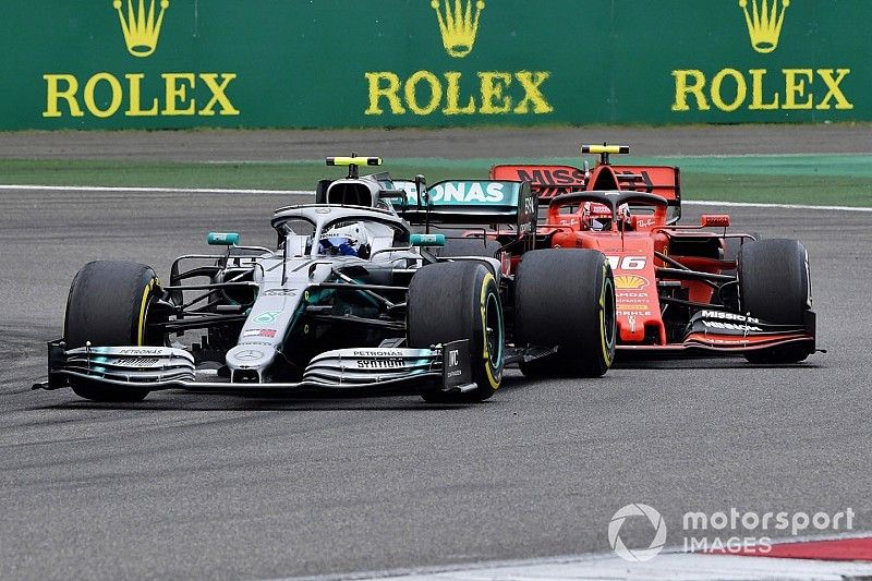 Valtteri Bottas, Mercedes AMG W10, battles with Charles Leclerc, Ferrari SF90