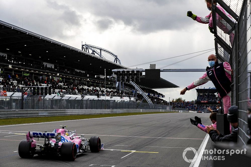 Nico Hulkenberg, Racing Point RP20, passes his team on the pit wall at the end of the race