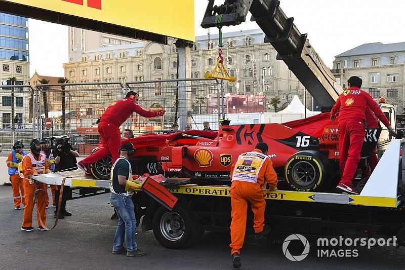 Crashed car of Charles Leclerc, Ferrari SF90 is retuned to Ferrari mechanics on the back of a low loader