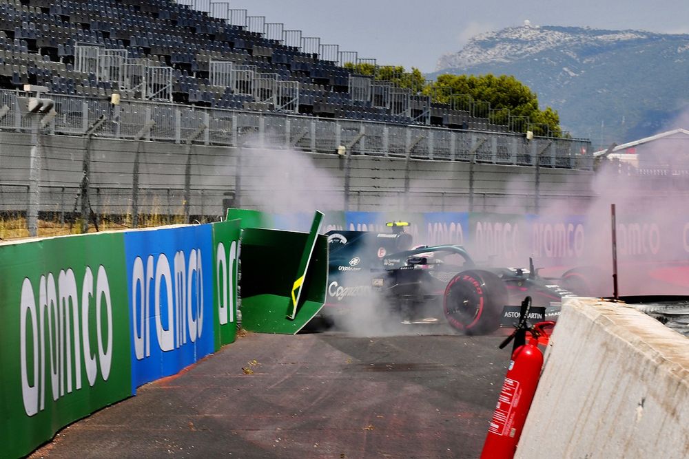 Sebastian Vettel, Aston Martin AMR21, hits a barrier after spinning in FP1