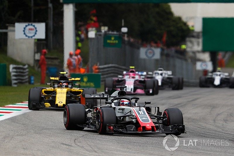 Romain Grosjean, Haas F1 Team VF-18, leads Carlos Sainz Jr., Renault Sport F1 Team RS 18, and Esteban Ocon, Racing Point Force India VJM11